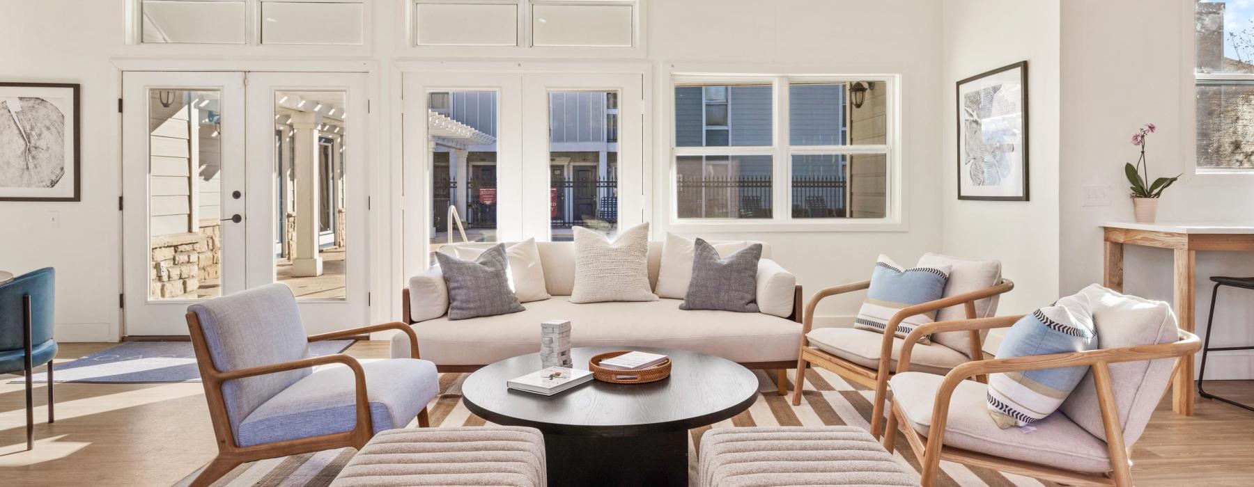 a spacious room with a couch and chairs